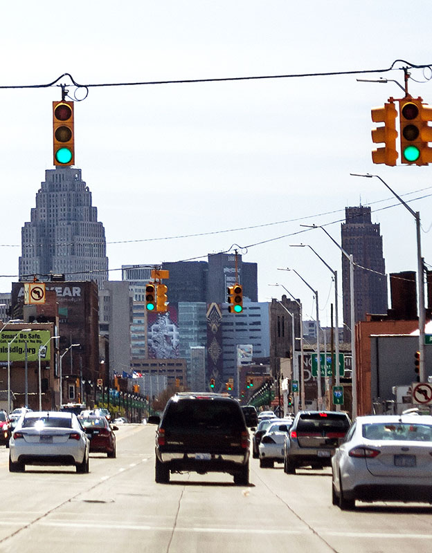view of streets of Detroit, Gratiot Avenue. with cars driving
