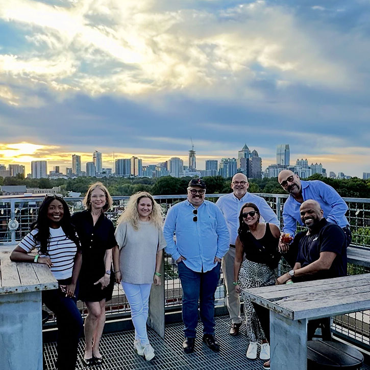 Arity employees on a rooftop lounge during ITS World Congress