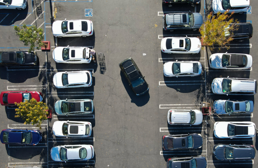 Photo of a car parking at a store parking lot